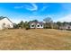 Residential neighborhood home situated on a spacious lot with mature trees at 81 Bridgemill Dr, Douglasville, GA 30134
