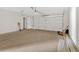 Clean, empty two-car garage with white walls and ample space for vehicles and storage at 81 Bridgemill Dr, Douglasville, GA 30134