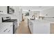 Modern kitchen with stainless steel appliances, island with seating, and an open layout perfect for entertaining at 81 Bridgemill Dr, Douglasville, GA 30134