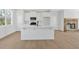 Contemporary kitchen with white cabinets, a functional island, and stainless appliances, creating a seamless cooking space at 81 Bridgemill Dr, Douglasville, GA 30134