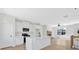 Beautiful kitchen featuring stainless appliances, an island with seating, and an open view to the living area at 81 Bridgemill Dr, Douglasville, GA 30134
