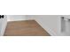Close-up of oak-look flooring with white trim and laundry hookups at 81 Bridgemill Dr, Douglasville, GA 30134