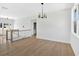 Upstairs living area featuring light wood floors and light fixtures at 81 Bridgemill Dr, Douglasville, GA 30134