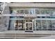 Modern building exterior of Midcity Lofts with large windows and stone accents, creating an inviting entrance at 845 Spring St # 125, Atlanta, GA 30308
