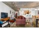 Open concept living space with kitchen and dining area, featuring modern decor and concrete ceilings at 845 Spring St # 125, Atlanta, GA 30308