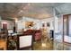 Wide angle shot of an open concept living space with kitchen, dining and exterior deck at 845 Spring St # 125, Atlanta, GA 30308