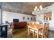 Open floor plan featuring the dining area, kitchen and living room with exposed ceilings and modern lighting at 845 Spring St # 125, Atlanta, GA 30308