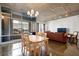 Open floor plan featuring the dining area, and a living room with floor to ceiling windows and concrete ceilings at 845 Spring St # 125, Atlanta, GA 30308