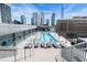 Rooftop pool with lounge chairs offering stunning cityscape views at 845 Spring St # 125, Atlanta, GA 30308