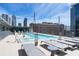 Beautiful rooftop pool area with comfortable lounge chairs and city view at 845 Spring St # 125, Atlanta, GA 30308
