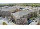 Scenic aerial view of a multifamily residential complex with beautiful landscaping and a parking garage at 10 Perimeter Summit Ne Blvd # 1204, Brookhaven, GA 30319