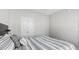 Bedroom featuring light grey walls and a patterned comforter at 10 Perimeter Summit Ne Blvd # 1204, Brookhaven, GA 30319