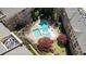 Aerial view of a community pool area featuring dual pools, landscaping, and seating at 10 Perimeter Summit Ne Blvd # 1204, Brookhaven, GA 30319