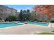 Community swimming pool with ample lounge chairs and lush landscaping at 10 Perimeter Summit Ne Blvd # 1204, Brookhaven, GA 30319