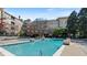 Beautiful community swimming pool with ample seating and landscaping at 10 Perimeter Summit Ne Blvd # 1204, Brookhaven, GA 30319