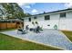 Backyard featuring pea gravel patio with outdoor seating, fire pit, and privacy fence at 1048 Pinehurst Se Dr, Smyrna, GA 30080