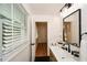 Bathroom with natural light, modern fixtures, wood vanity, and an open view at 1048 Pinehurst Se Dr, Smyrna, GA 30080