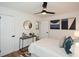 Cozy bedroom with stylish furnishings, artwork, ceiling fan, and open closet at 1048 Pinehurst Se Dr, Smyrna, GA 30080