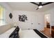 Comfortable bedroom featuring modern decor, neutral tones, and a large window for natural light at 1048 Pinehurst Se Dr, Smyrna, GA 30080