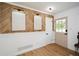 Stylish entryway featuring a wood-look accent wall and natural light at 1048 Pinehurst Se Dr, Smyrna, GA 30080