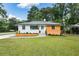 Beautifully renovated single-story home with a manicured front yard and freshly painted exterior at 1048 Pinehurst Se Dr, Smyrna, GA 30080