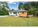 Charming single-story home with a well-manicured lawn, newly painted exterior and tasteful landscaping at 1048 Pinehurst Se Dr, Smyrna, GA 30080