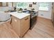 Charming kitchen island with modern appliances, a sleek cooktop, and a bright, inviting design at 1048 Pinehurst Se Dr, Smyrna, GA 30080