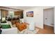 Inviting living room with hardwood floors and open concept access to kitchen at 1048 Pinehurst Se Dr, Smyrna, GA 30080