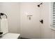 Bathroom shower with herringbone tile surround, shower niche, and matte black hardware at 1048 Pinehurst Se Dr, Smyrna, GA 30080