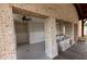 Covered outdoor bar area with stainless steel appliances and a brick frame for food and beverage preparation at 1132 Larkin Dr # 34, Buford, GA 30518