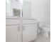 Clean, modern bathroom features a white vanity with granite counters, tiled floor, and modern fixtures at 1132 Larkin Dr # 34, Buford, GA 30518