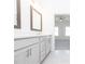 Elegant bathroom features double sinks, quartz countertops, modern lighting, and sleek fixtures at 1132 Larkin Dr # 34, Buford, GA 30518