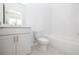 Clean bathroom with a white vanity, toilet, subway tile shower, and bright lighting at 1132 Larkin Dr # 34, Buford, GA 30518