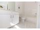 Bright bathroom with single sink vanity, white cabinets, subway tile, and tub shower combo at 1132 Larkin Dr # 34, Buford, GA 30518