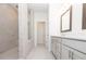 Bright bathroom with a glass-enclosed shower, double vanity, and white tile, offering a modern and relaxing space at 1132 Larkin Dr # 34, Buford, GA 30518