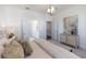 Bright bedroom features a modern light fixture and entry to the bathroom and walk-in closet at 1132 Larkin Dr # 34, Buford, GA 30518