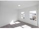 Light-filled bedroom with plush carpeting and ample natural light streaming through the bright, sun-drenched windows at 1132 Larkin Dr # 34, Buford, GA 30518
