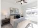 Bright bedroom with a neutral palette, large window and stylish side tables at 1132 Larkin Dr # 34, Buford, GA 30518