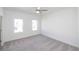 Bright bedroom with plush carpeting, neutral walls, and sun-drenched windows offering natural light at 1132 Larkin Dr # 34, Buford, GA 30518