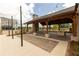 Community amenity with a fireplace, a large table, and a covered wooden structure at 1132 Larkin Dr # 34, Buford, GA 30518