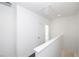 Bright hallway features white walls, white trim, and light flooring, creating a clean and inviting transition space at 1132 Larkin Dr # 34, Buford, GA 30518