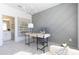 Bright home office featuring a modern desk, chair, stylish light fixture, and decorative accent wall at 1132 Larkin Dr # 34, Buford, GA 30518