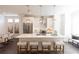 A modern kitchen with island, pendant lights, stainless steel appliances, and seating at 1132 Larkin Dr # 34, Buford, GA 30518