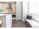Modern kitchen featuring stainless appliances, white cabinets and a dining nook at 1132 Larkin Dr # 34, Buford, GA 30518