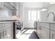 Modern kitchen with stainless steel appliances, white cabinets, and ample natural light at 1132 Larkin Dr # 34, Buford, GA 30518
