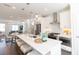 Modern, open-concept kitchen with stainless steel appliances, pendant lighting, and a large center island at 1132 Larkin Dr # 34, Buford, GA 30518