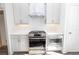 Modern kitchen featuring stainless steel appliances and white cabinets at 1132 Larkin Dr # 34, Buford, GA 30518