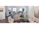 Open-concept home with dining table and living room with fireplace at 1132 Larkin Dr # 34, Buford, GA 30518