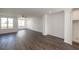 Bright living room featuring hardwood floors, a ceiling fan, and large windows at 1132 Larkin Dr # 34, Buford, GA 30518