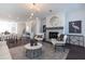 Cozy living room features a stone fireplace, neutral tones, and an open-concept layout at 1132 Larkin Dr # 34, Buford, GA 30518